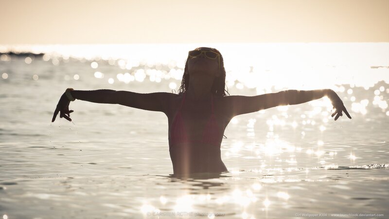 woman in bikini at sunset