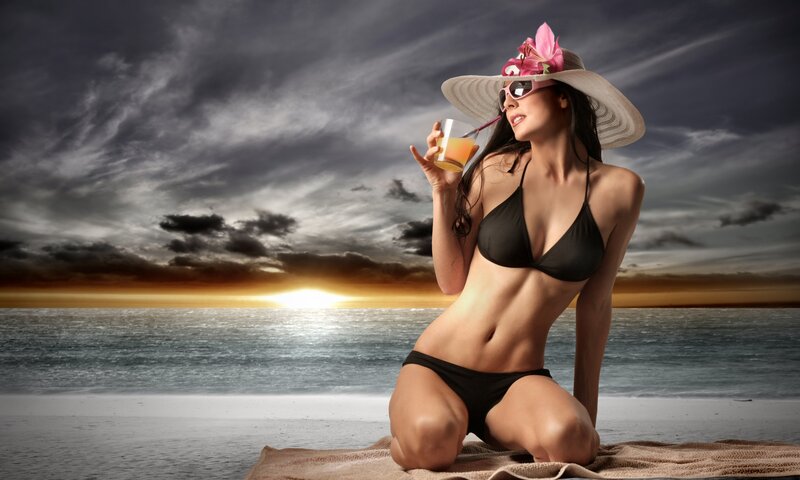 Woman in bikini at sunset
