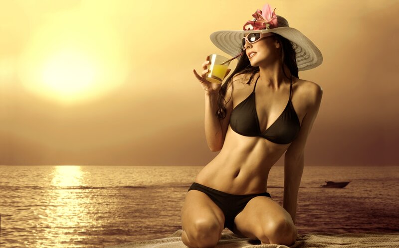 Woman in bikini at sunset