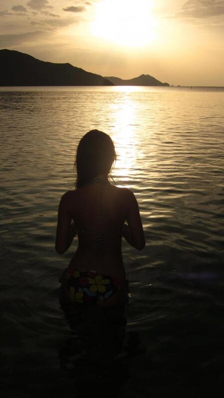 woman in bikini at sunset