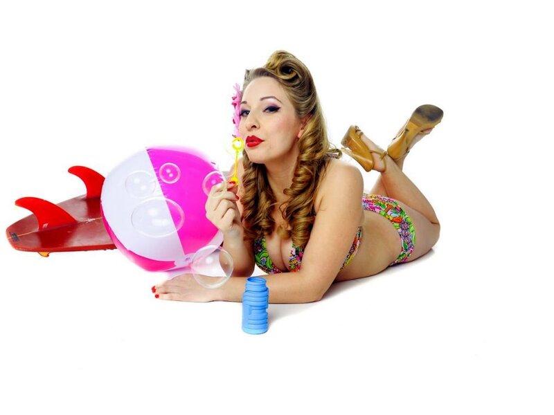 Woman in Bikini Blowing Bubbles