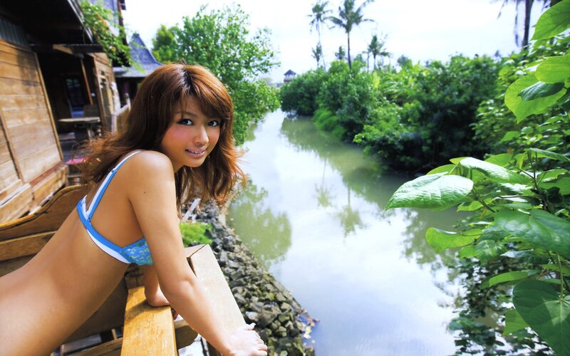 Woman in bikini by a canal