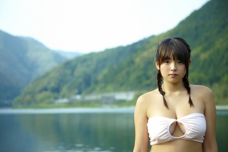 Woman in bikini by lake