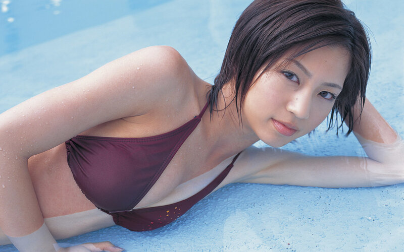 woman in bikini by pool