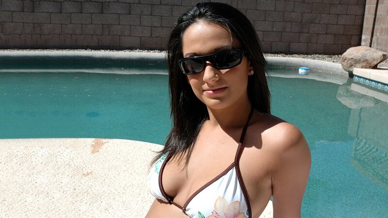 Woman in bikini by pool