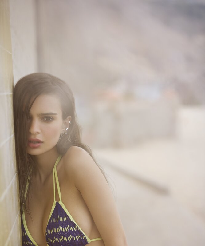 woman in bikini by wall