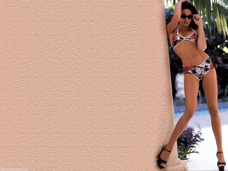 woman in bikini by wall