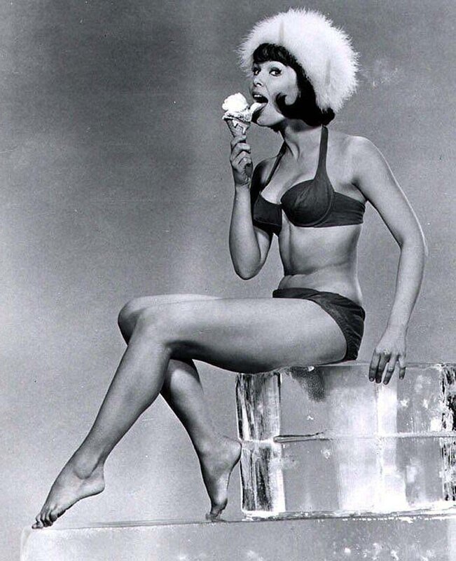 Woman in bikini eating ice cream