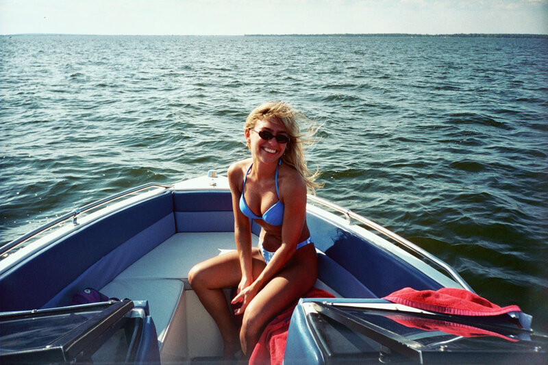 Woman in Bikini on Boat — Blue, Relaxed, Afternoon, Photograph, Sunglasses, Towel