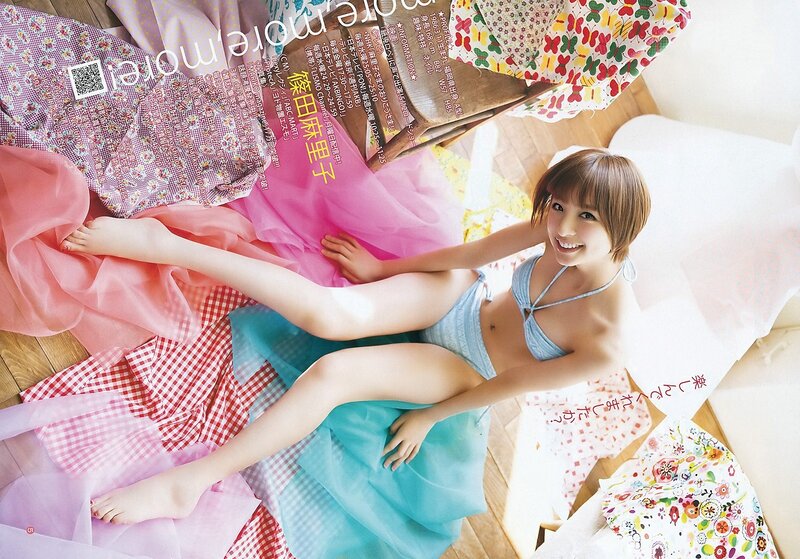 woman in bikini on colorful fabrics