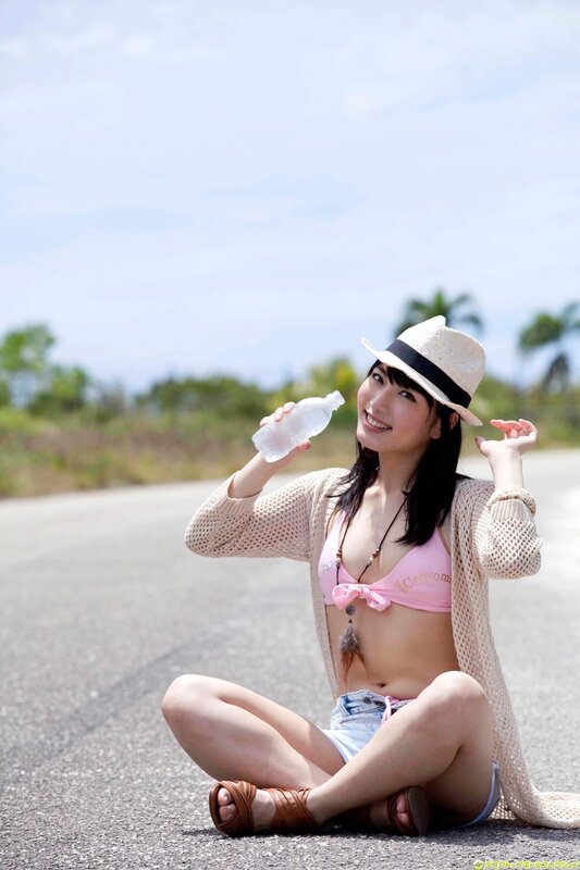 Woman in bikini on road