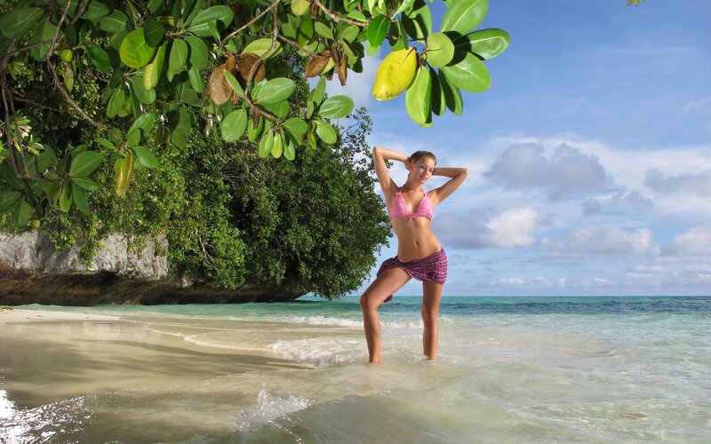 Woman in bikini on tropical beach