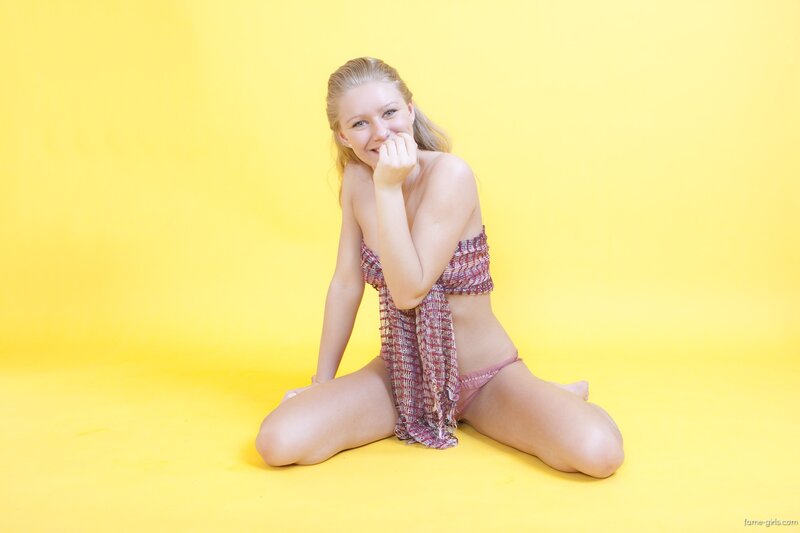 woman in bikini on yellow background