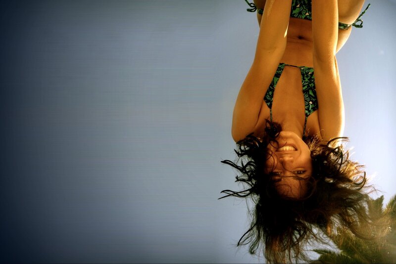woman in bikini smiling upside down