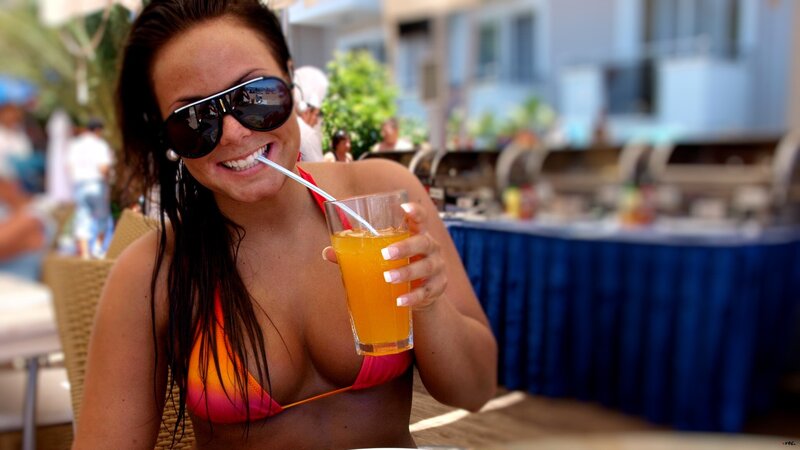 woman in bikini with drink
