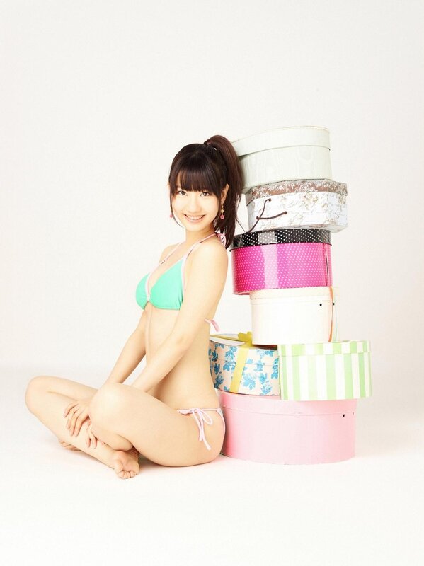 woman in bikini with gift boxes