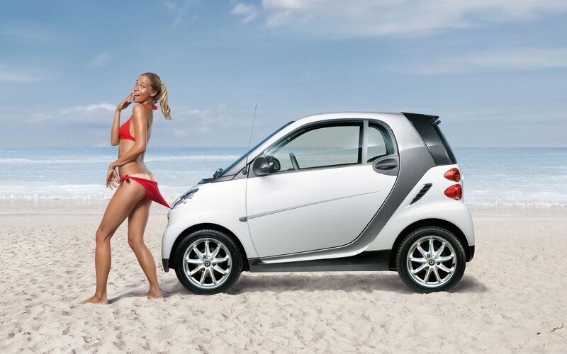 Woman in bikini with smart car