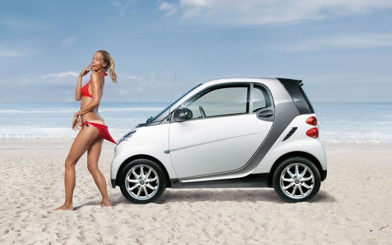 Woman in bikini with smart car