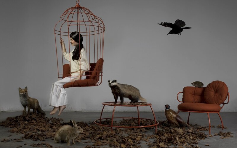 Woman in Birdcage Chair — Gray, Dramatic