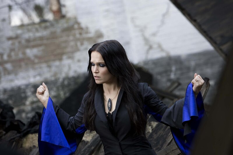Woman in Black and Blue Coat — Dramatic