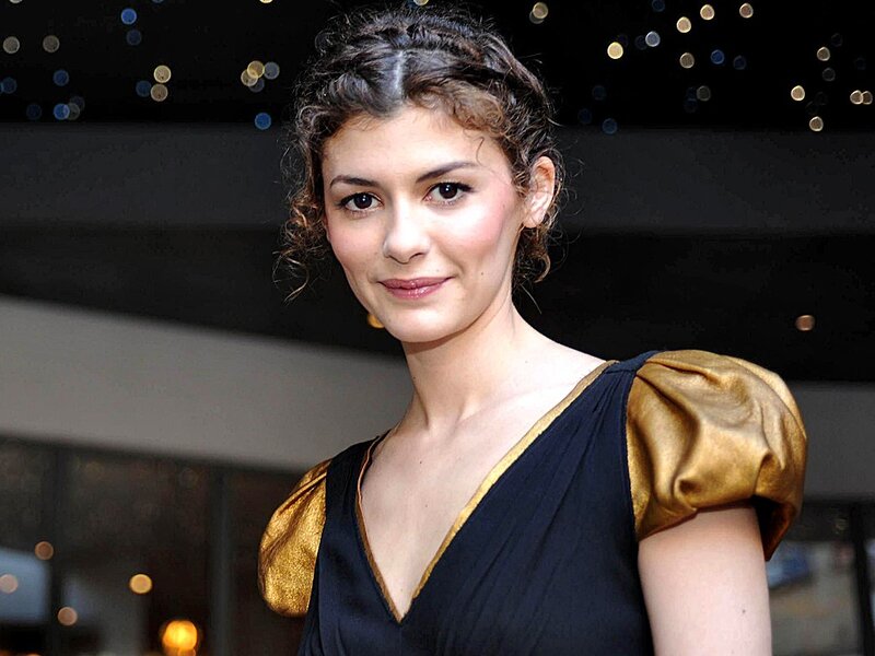 woman in black and gold dress