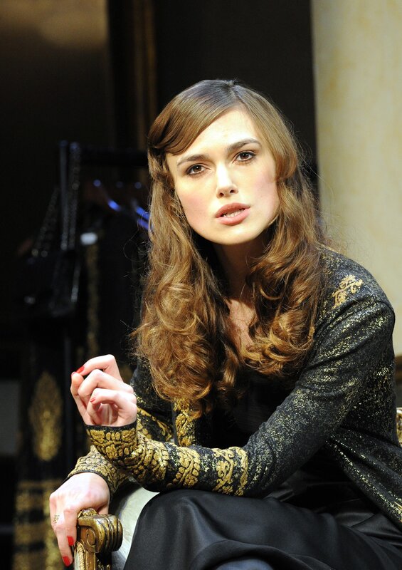 woman in black and gold dress