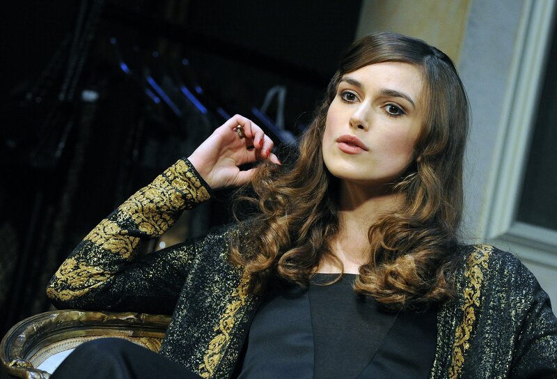 woman in black and gold jacket