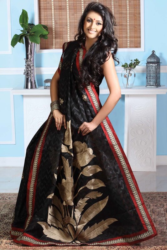 woman in black and gold saree