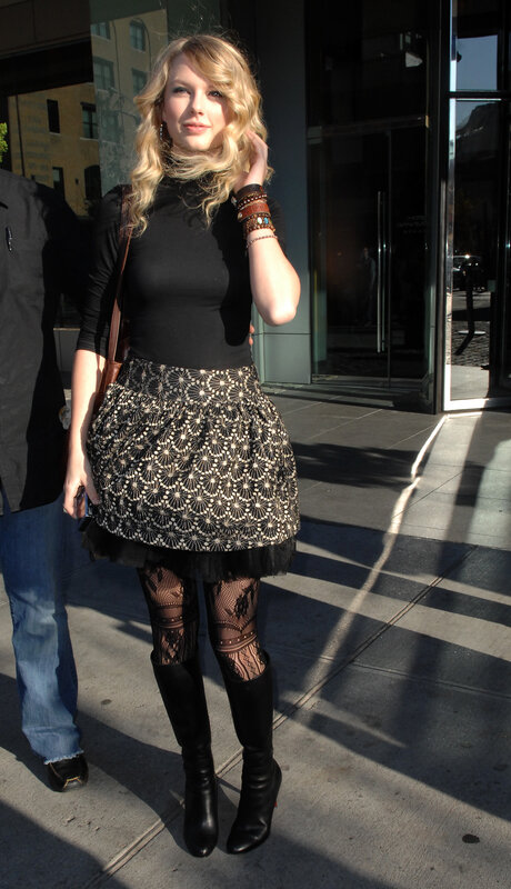 woman in black and patterned outfit