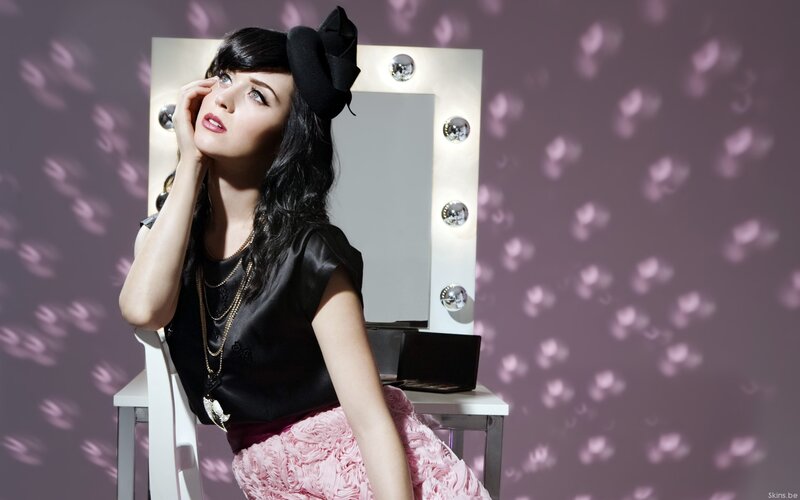 woman in black and pink outfit