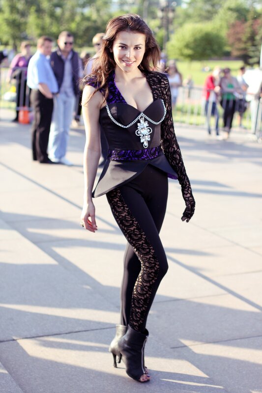 Woman in Black and Purple Outfit — Confident