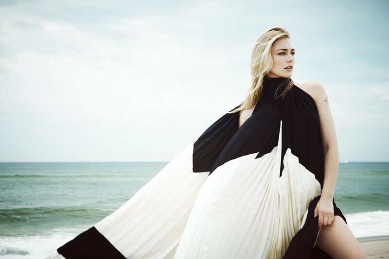 woman in black and white dress on beach