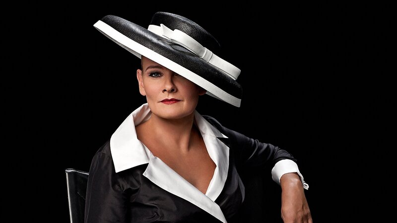 woman in black and white hat