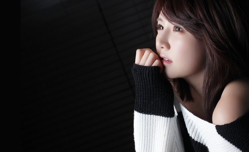 woman in black and white sweater