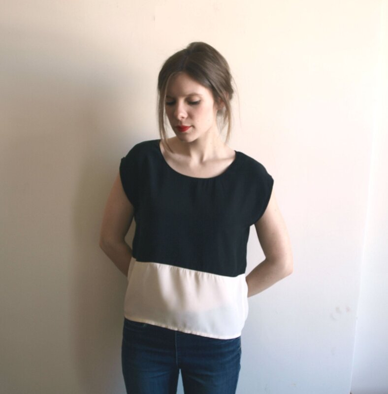 woman in black and white top