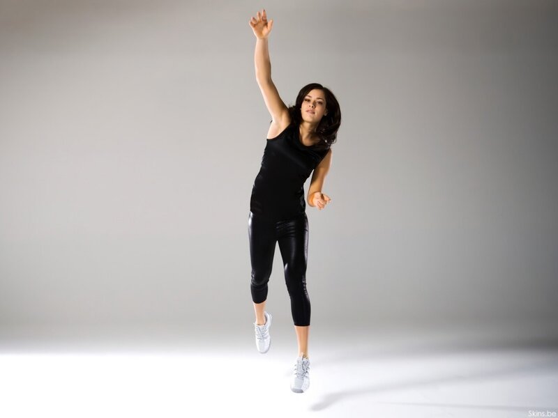 woman in black athletic wear jumping
