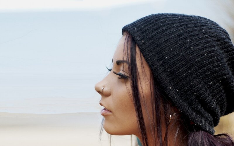 Woman in Black Beanie — Contemplative