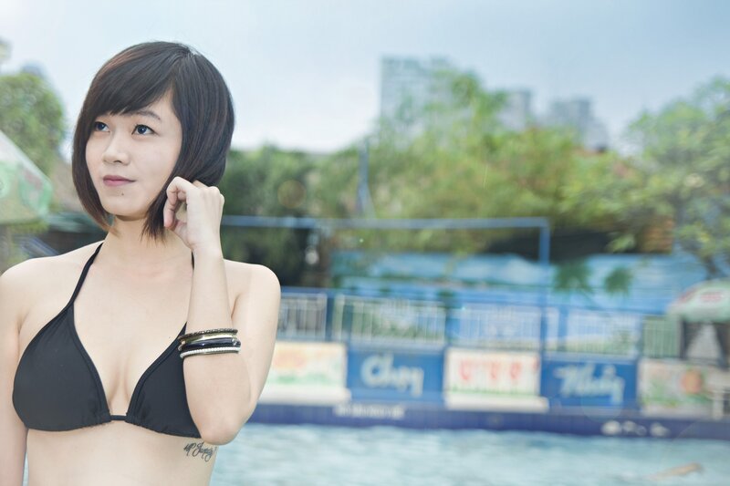 woman in black bikini at pool