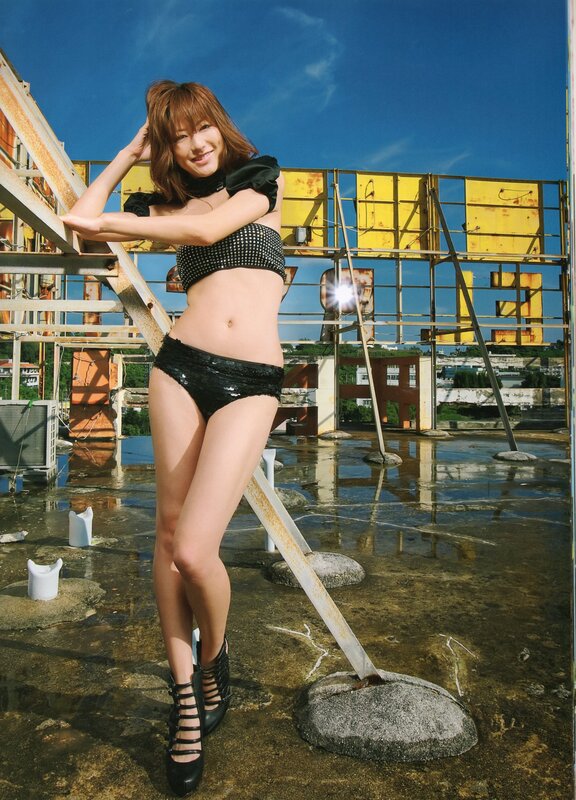 Woman in black bikini on rooftop
