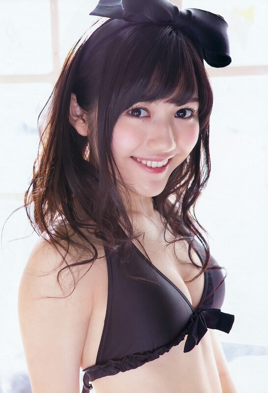 woman in black bikini smiling