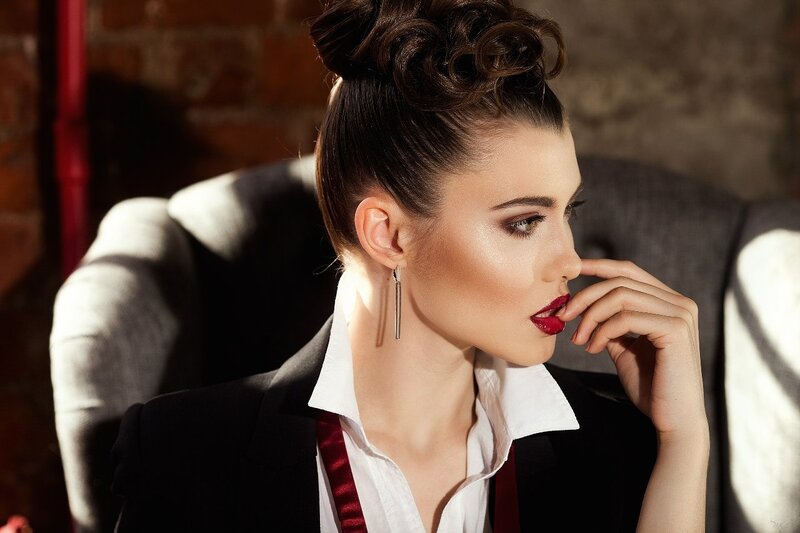 Woman in Black Blazer — Dramatic, Photograph, Brick Wall