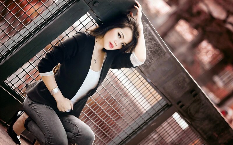 woman in black blazer posing