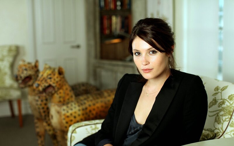woman in black blazer sitting