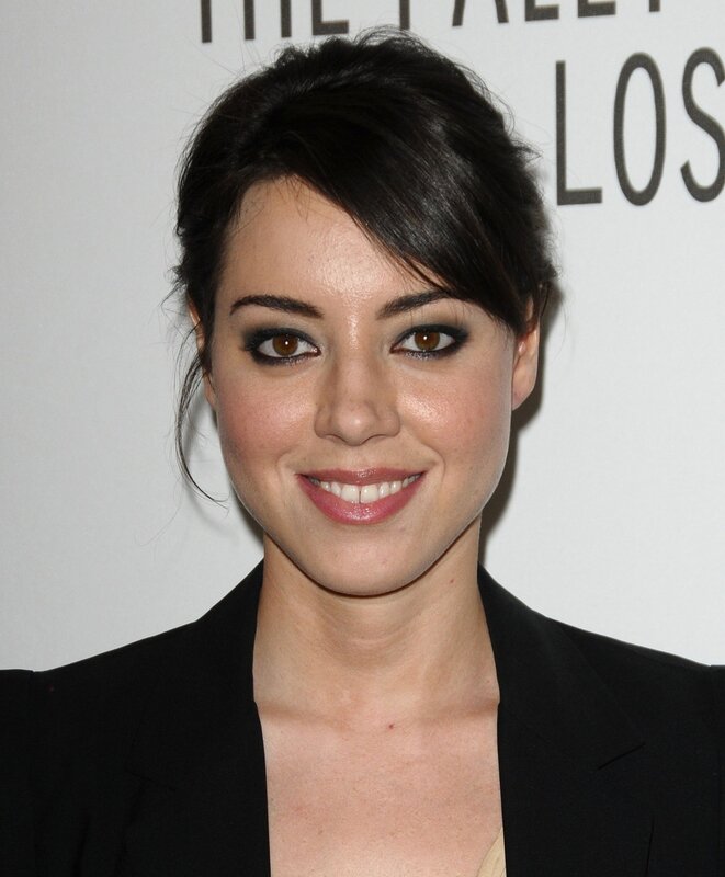 woman in black blazer smiling