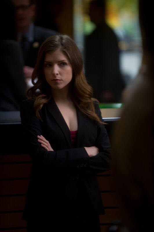 woman in black blazer standing