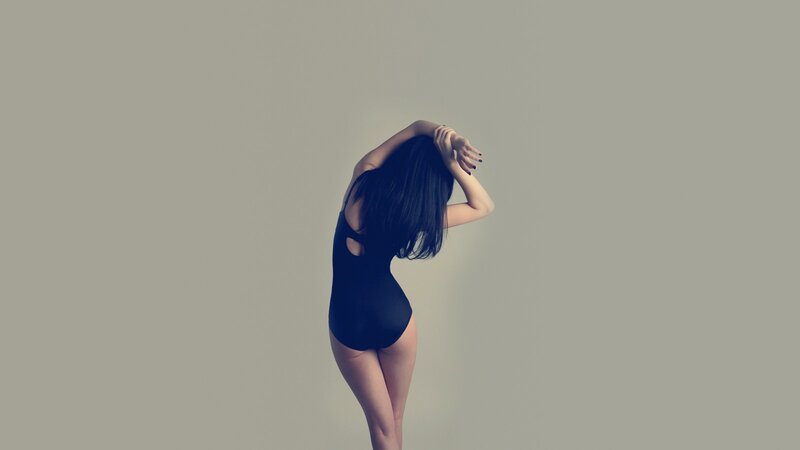 woman in black bodysuit