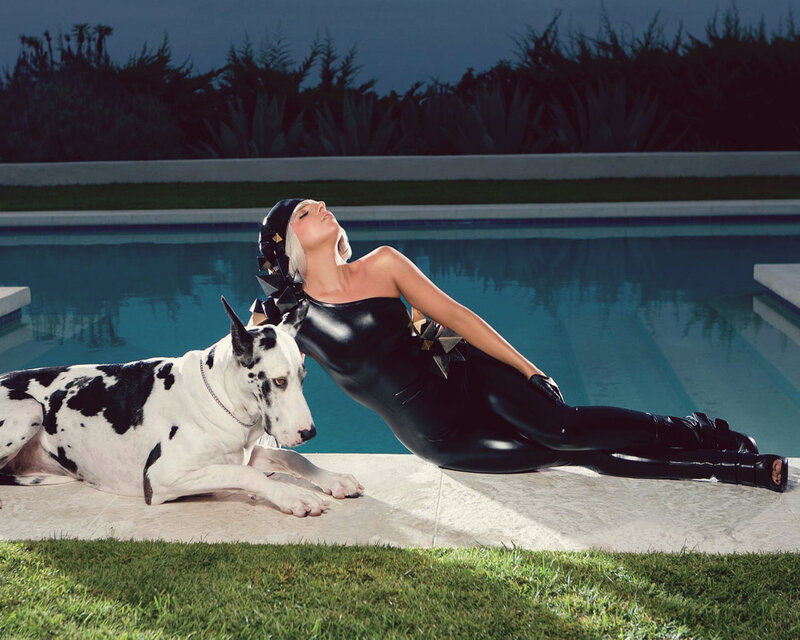 Woman in black bodysuit by pool