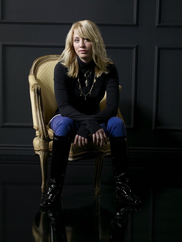 woman in black boots sitting