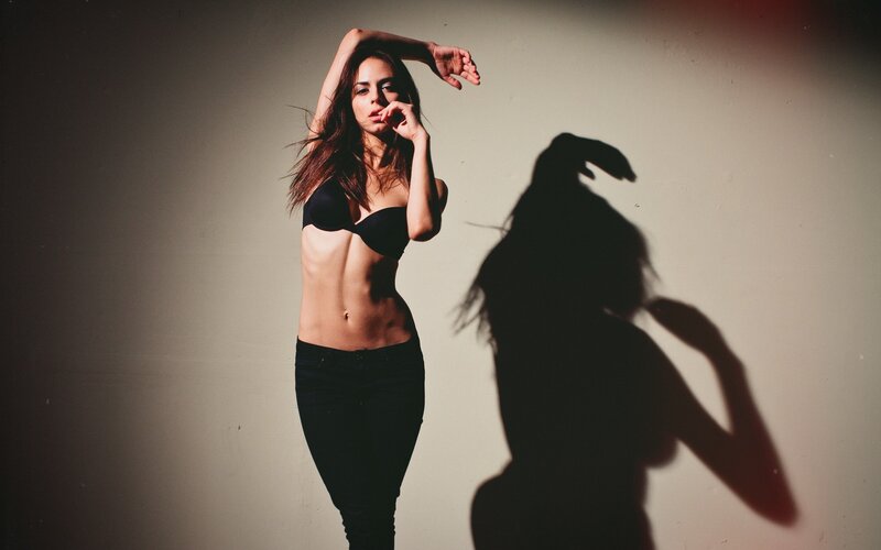 Woman in Black Bra — Dramatic, Photograph, Shadow