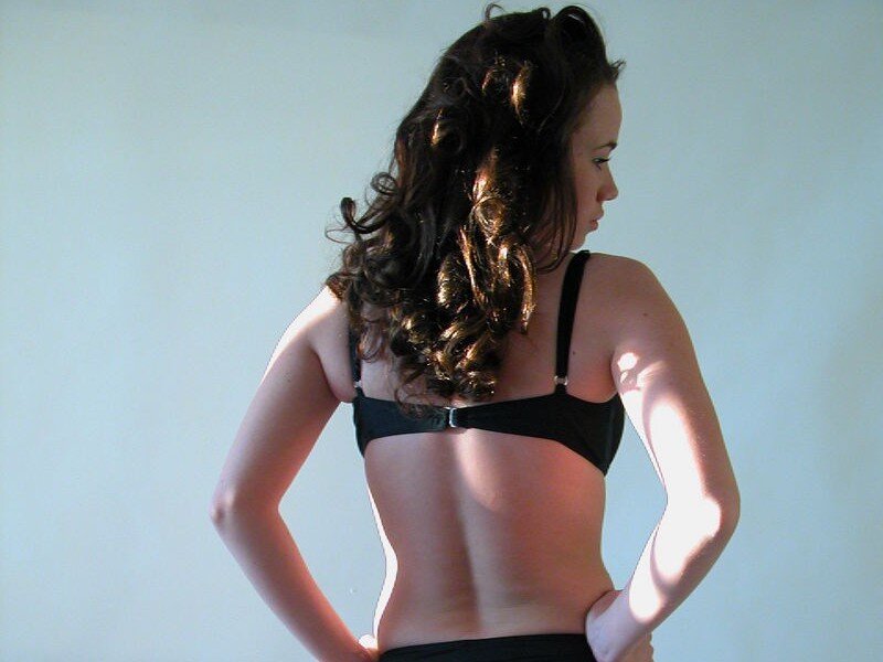 woman in black bra from back